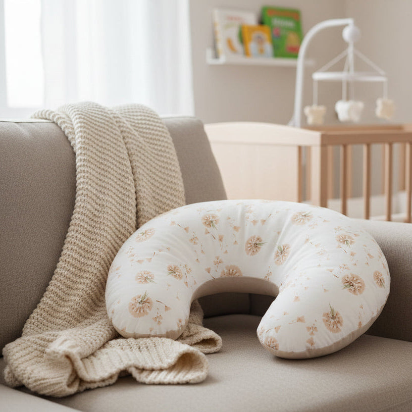 White U-shaped pillow with floral pattern on a white background