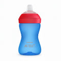 Blue sippy cup with red lid on a white background, featuring Philips Avent logo.